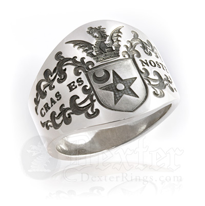 cigar band style ring engraved with ornate coat of arms