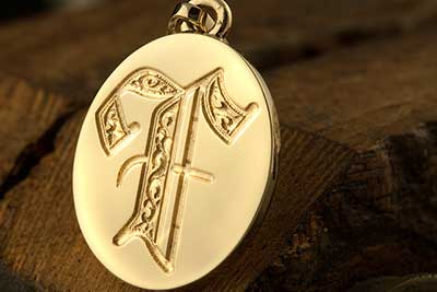 Initial Letter F Deep Engraved on a Pendant