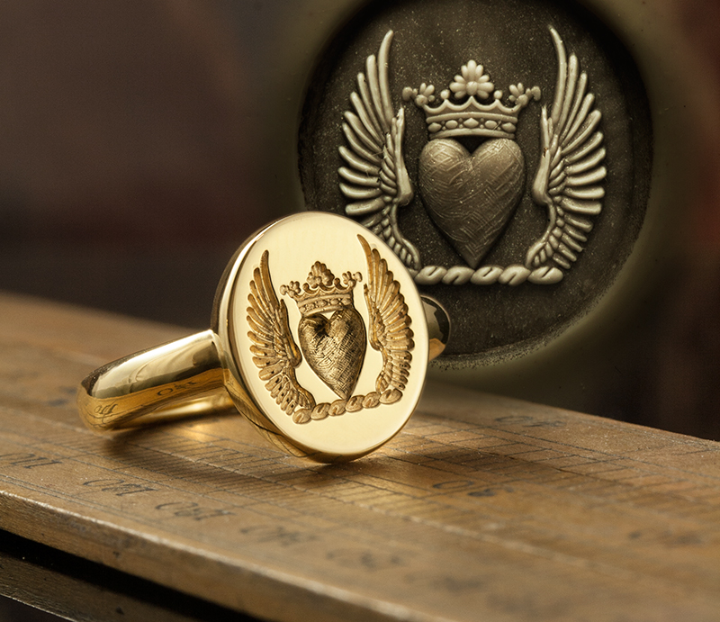 Romanesque Slimline Signet with heart between wings crest