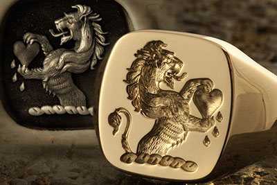 Lion Holding Bleeding Heart Crest Cushion Ring