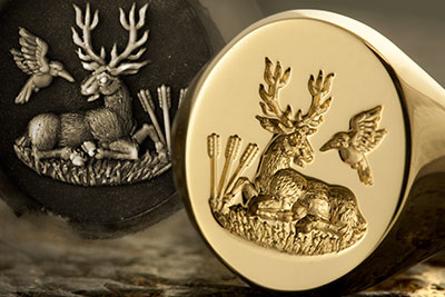 Signet ring engraved with crest of Stag laying down arrows bird
