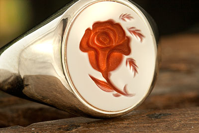 Signet ring red stone engraved with rose design
