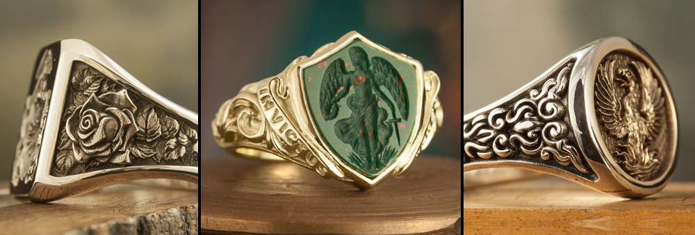 selection of three sculptural signet rings